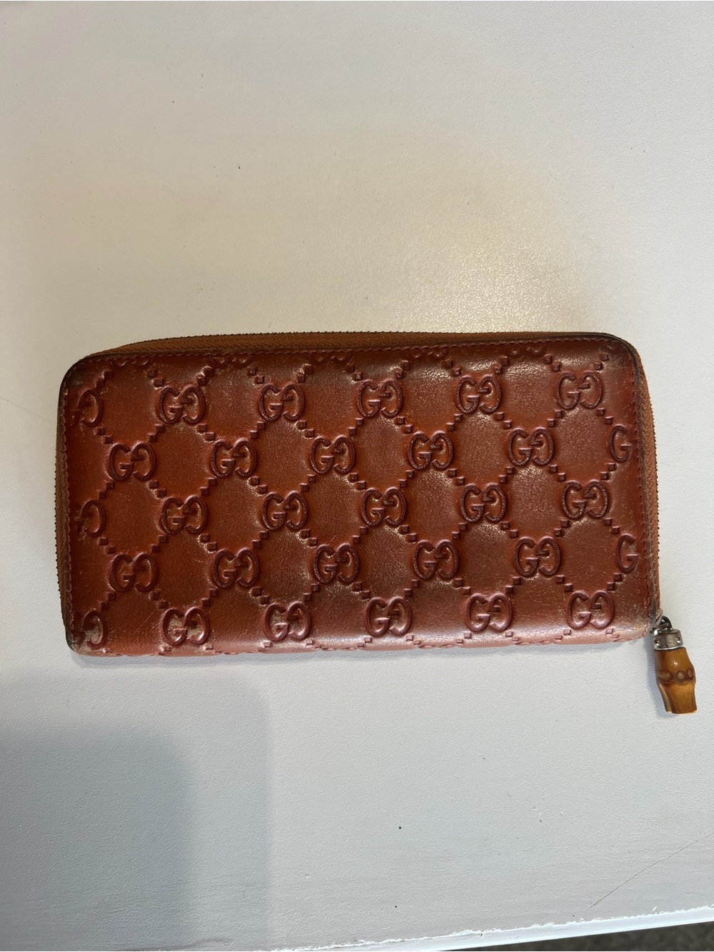 Gucci Brown Embossed GG Leather Zip Wallet with Bamboo Pull